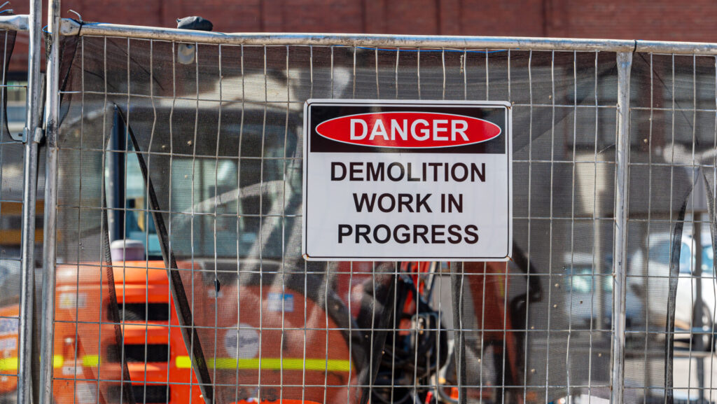 Danger, demolition work in progress sign in a real construction